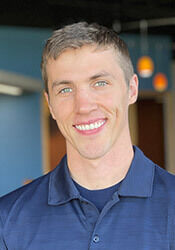 Headshot of Adam Pleschourt